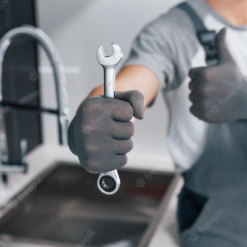 Plumber holding a wrench